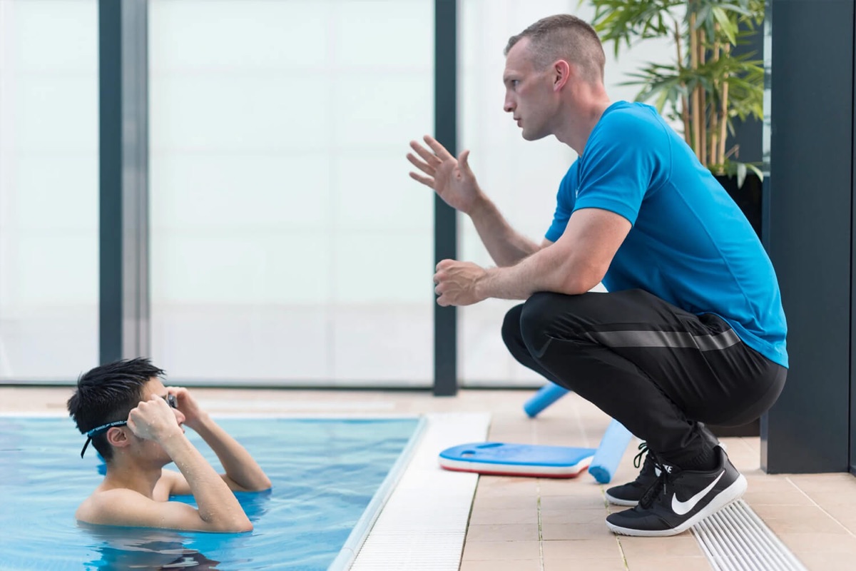A Swim Now coach giving a private swimming lesson